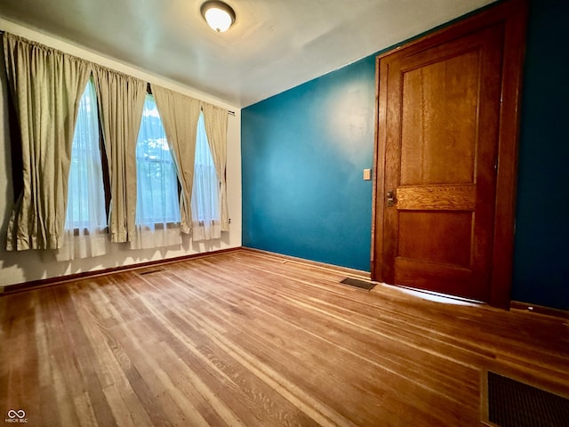 308 W Walnut St, Brownstown, IN 47220 - empty room with wood finished floors and baseboards