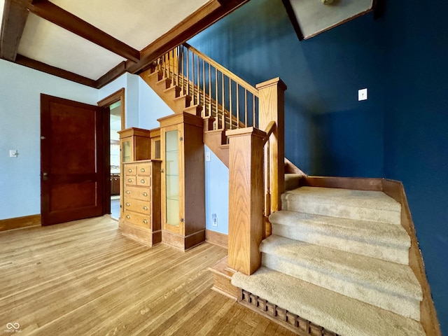 308 W Walnut St, Brownstown, IN 47220 - stairs featuring baseboards, wood finished floors, and beamed ceiling