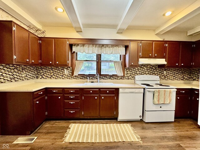 308 W Walnut St, Brownstown, IN 47220 - kitchen featuring white appliances, a sink, beam ceiling, under cabinet range hood, and wood finished floors
