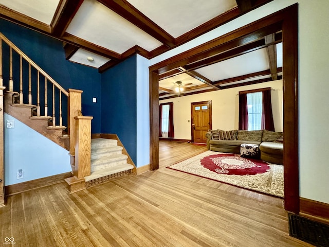 308 W Walnut St, Brownstown, IN 47220 - living area featuring coffered ceiling, hardwood / wood-style flooring, stairs, beamed ceiling, and baseboards
