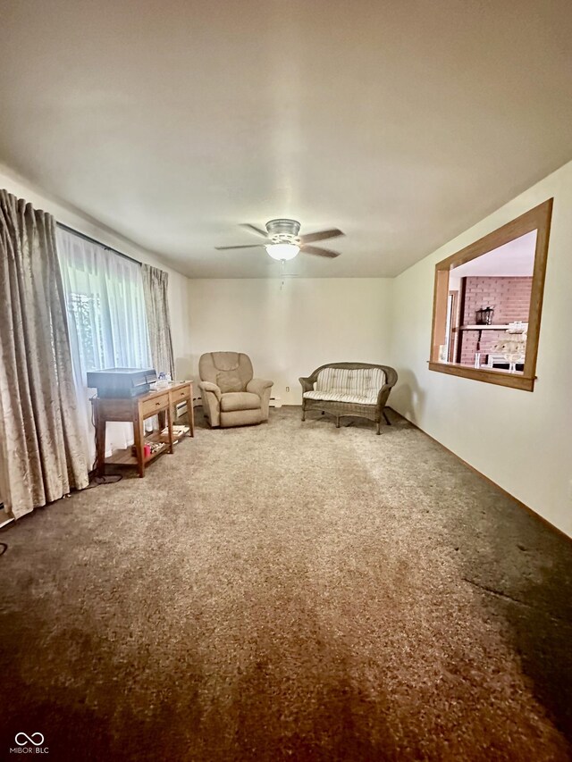 1154 W US Highway 136, Veedersburg, IN 47987 - carpeted living room with a ceiling fan