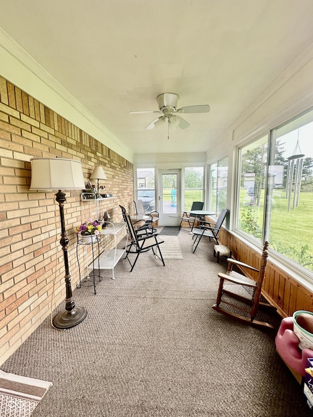 1154 W US Highway 136, Veedersburg, IN 47987 - sunroom / solarium featuring brick wall, a ceiling fan, carpet, and crown molding