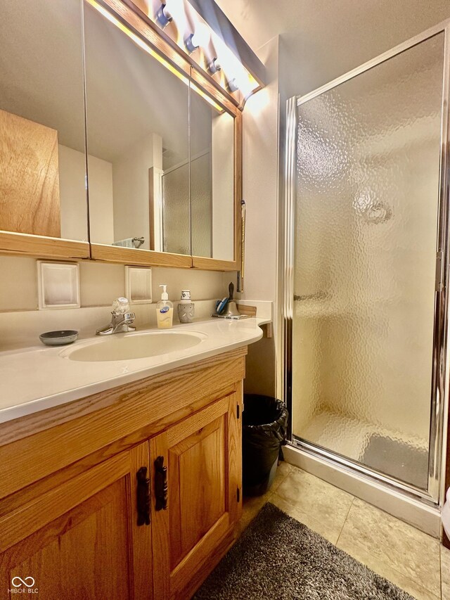 1154 W US Highway 136, Veedersburg, IN 47987 - bathroom with a shower stall, vanity, and tile patterned floors