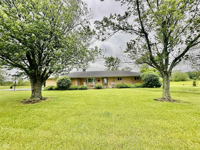 1154 W US Highway 136, Veedersburg, IN 47987 - ranch-style home with a front lawn, brick siding, and a chimney