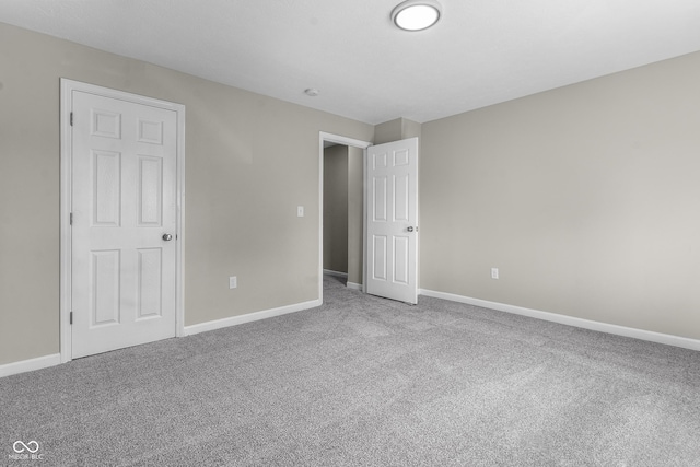 418 Harlan St, Indianapolis, IN 46201 - unfurnished bedroom with carpet and baseboards