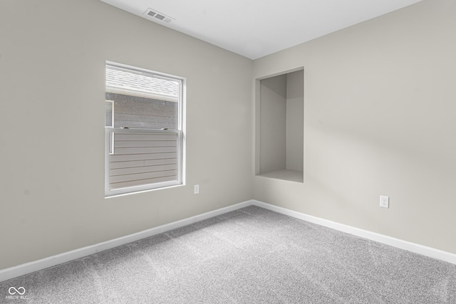 418 Harlan St, Indianapolis, IN 46201 - carpeted empty room with baseboards