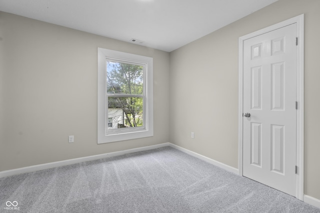 418 Harlan St, Indianapolis, IN 46201 - carpeted spare room featuring baseboards