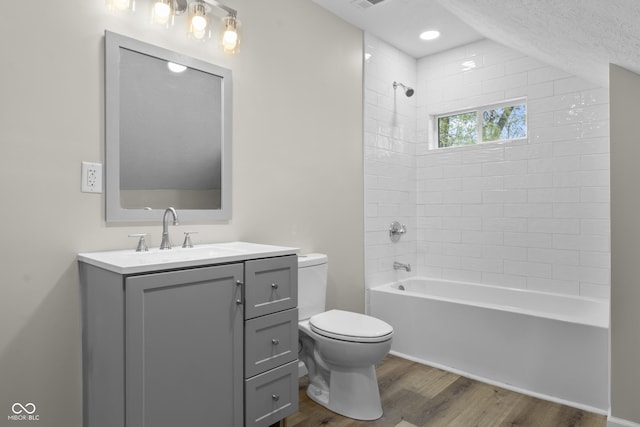 418 Harlan St, Indianapolis, IN 46201 - full bathroom featuring wood finished floors, toilet, bathtub / shower combination, and vanity