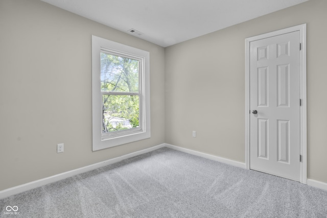 418 Harlan St, Indianapolis, IN 46201 - carpeted spare room with baseboards