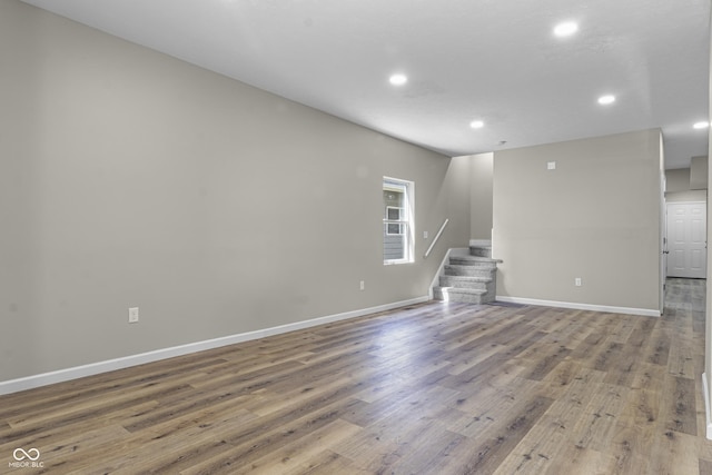 418 Harlan St, Indianapolis, IN 46201 - empty room with recessed lighting, stairs, wood finished floors, and baseboards