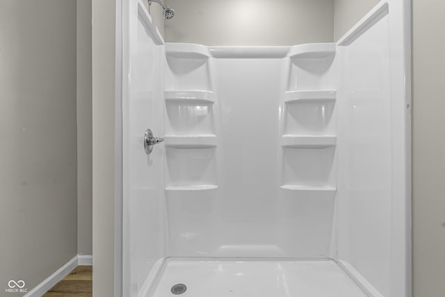 418 Harlan St, Indianapolis, IN 46201 - full bathroom featuring baseboards and a shower stall