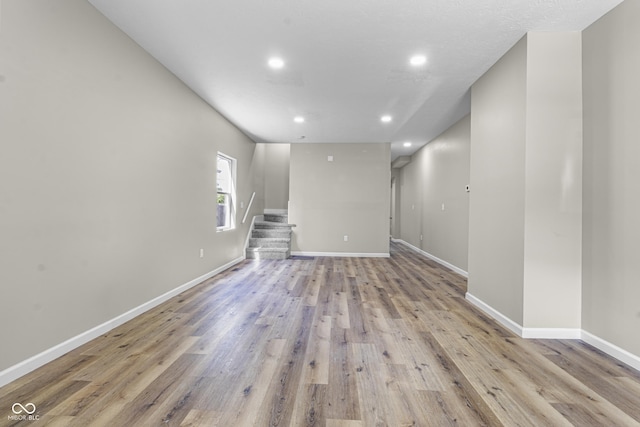 418 Harlan St, Indianapolis, IN 46201 - spare room with recessed lighting, wood finished floors, baseboards, and stairway