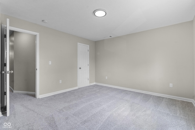 418 Harlan St, Indianapolis, IN 46201 - unfurnished bedroom with carpet flooring and baseboards