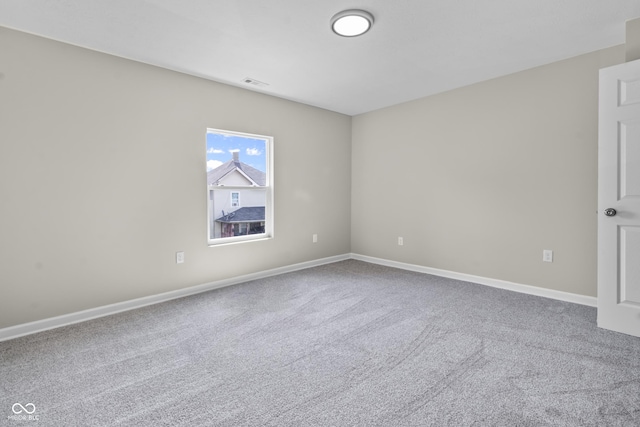 418 Harlan St, Indianapolis, IN 46201 - carpeted spare room with baseboards