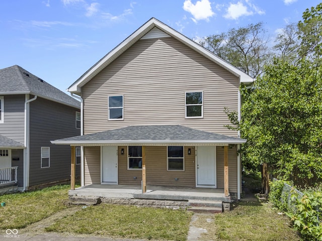 418 Harlan St, Indianapolis, IN 46201 - view of front of home with covered porch and a front yard