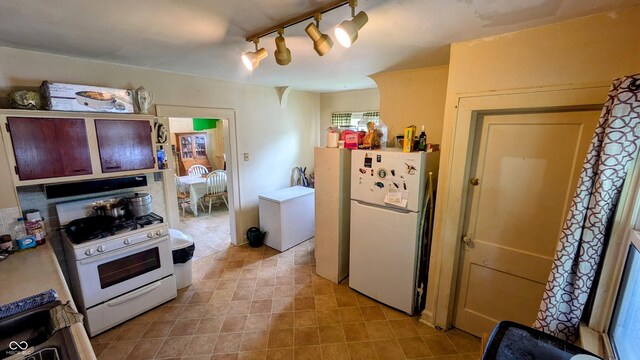 100 N 6th Ave, Beech Grove, IN 46107 - kitchen featuring white appliances and track lighting