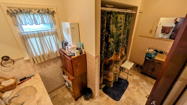 100 N 6th Ave, Beech Grove, IN 46107 - bathroom with tile walls, a wainscoted wall, vanity, and curtained shower