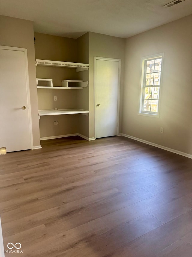 2931 Byrkit St, Indianapolis, IN 46217 - unfurnished bedroom with wood finished floors and baseboards