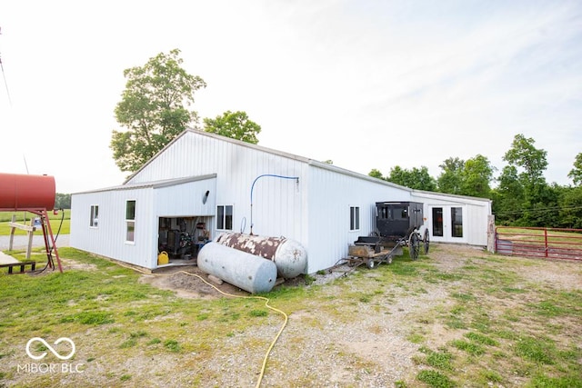 6190 E County Road 800 N, North Vernon, IN 47265 - back of property featuring french doors, a pole building, a detached garage, and an outbuilding