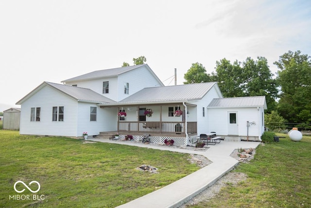 6190 E County Road 800 N, North Vernon, IN 47265 - rear view of house featuring a porch, a yard, and metal roof