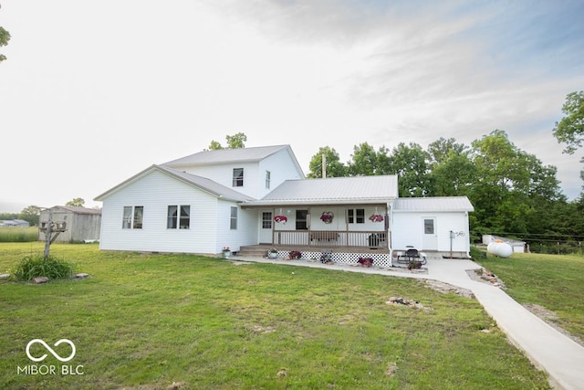 6190 E County Road 800 N, North Vernon, IN 47265 - back of property featuring covered porch, a lawn, and metal roof