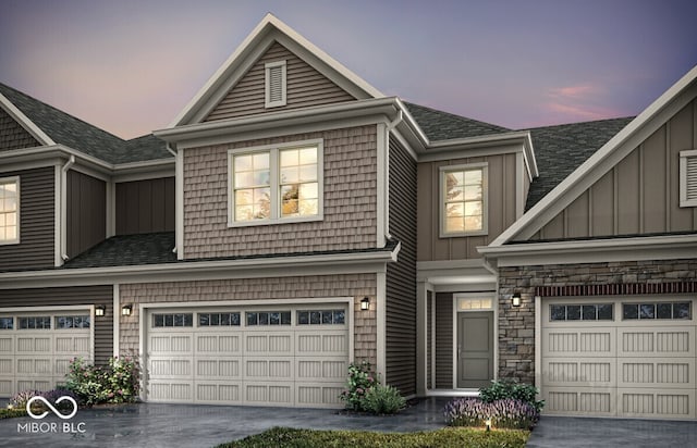 14866 E Keenan Cir Lot 38, Westfield, IN 46074 - view of front facade featuring an attached garage, board and batten siding, roof with shingles, and driveway