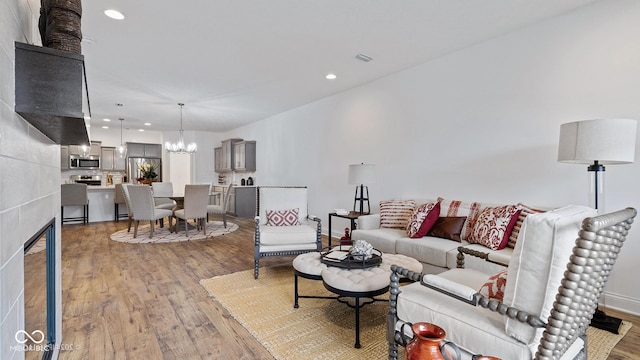 14866 E Keenan Cir Lot 38, Westfield, IN 46074 - living area with a chandelier, light wood-type flooring, recessed lighting, and baseboards