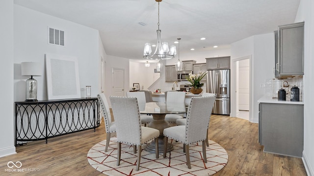 14866 E Keenan Cir Lot 38, Westfield, IN 46074 - dining room with light wood finished floors, a chandelier, recessed lighting, and baseboards