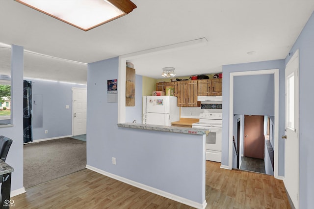 7915 Broadview Dr, Indianapolis, IN 46227 - kitchen featuring white appliances, light wood-style floors, light countertops, under cabinet range hood, and baseboards