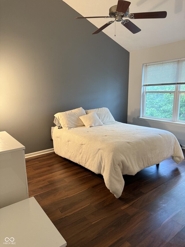 9535 Longwell Dr, Indianapolis, IN 46240 - bedroom featuring lofted ceiling, dark wood-style floors, a ceiling fan, and baseboards