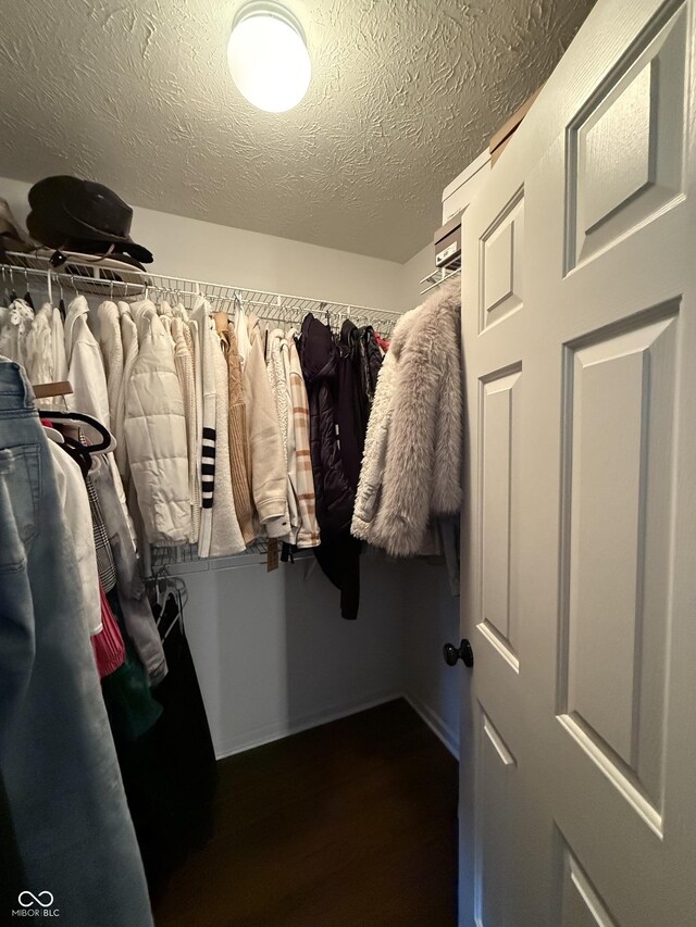 9535 Longwell Dr, Indianapolis, IN 46240 - walk in closet featuring dark wood-type flooring