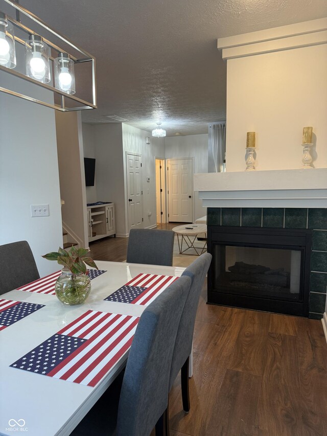 9535 Longwell Dr, Indianapolis, IN 46240 - dining area with a tiled fireplace and wood finished floors