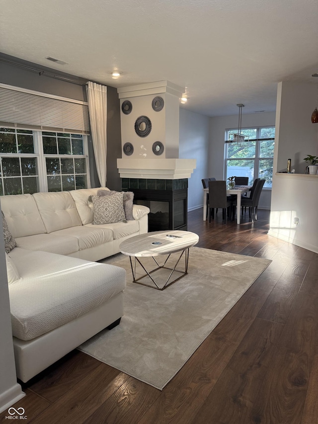 9535 Longwell Dr, Indianapolis, IN 46240 - living area featuring a fireplace, dark wood-type flooring, and baseboards