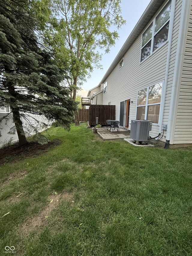 9535 Longwell Dr, Indianapolis, IN 46240 - view of yard featuring central air condition unit and a patio