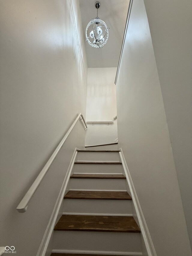 9535 Longwell Dr, Indianapolis, IN 46240 - stairs featuring a chandelier