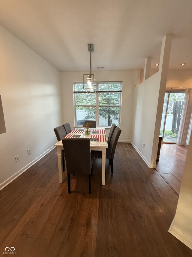 9535 Longwell Dr, Indianapolis, IN 46240 - dining area with healthy amount of natural light, dark wood-style floors, and baseboards