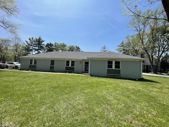 7731 Scarborough Blvd S, Indianapolis, IN 46256 - rear view of property featuring a yard and roof with shingles