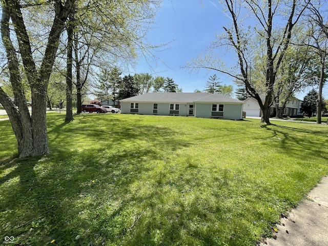 7731 Scarborough Blvd S, Indianapolis, IN 46256 - ranch-style house with a front yard