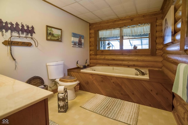 10484 N County Road 750 W, Freetown, IN 47235 - full bathroom featuring log walls, a bath, toilet, and vanity