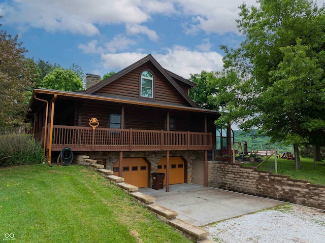 10484 N County Road 750 W, Freetown, IN 47235 - back of house with a chimney, a garage, concrete driveway, and a lawn