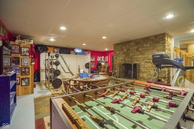 10484 N County Road 750 W, Freetown, IN 47235 - playroom with a paneled ceiling, a stone fireplace, and recessed lighting