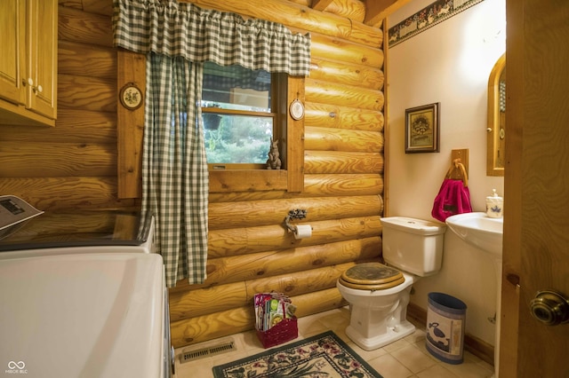 10484 N County Road 750 W, Freetown, IN 47235 - half bath with rustic walls, toilet, and tile patterned floors