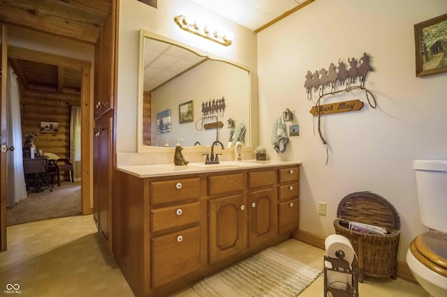 10484 N County Road 750 W, Freetown, IN 47235 - bathroom with toilet, vanity, and log walls