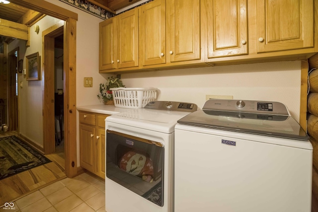 10484 N County Road 750 W, Freetown, IN 47235 - laundry room with cabinet space, washing machine and dryer, and light tile patterned floors