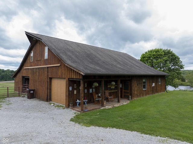 10484 N County Road 750 W, Freetown, IN 47235 - exterior space featuring a shingled roof, a detached garage, an outdoor structure, a barn, and gravel driveway