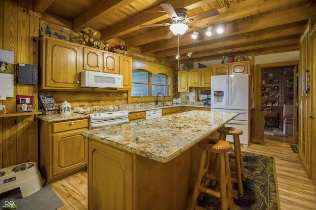 10484 N County Road 750 W, Freetown, IN 47235 - kitchen featuring white appliances, wood ceiling with exposed beams, light wood-style flooring, light stone counters, and a ceiling fan