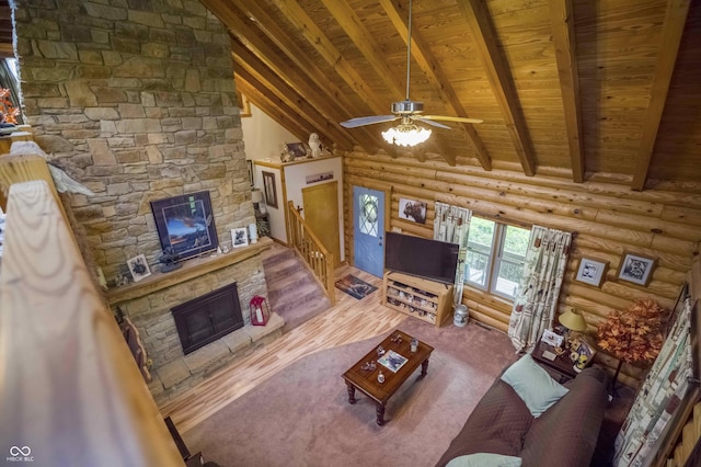 10484 N County Road 750 W, Freetown, IN 47235 - living area with a fireplace, wooden ceiling, rustic walls, a ceiling fan, and stairway