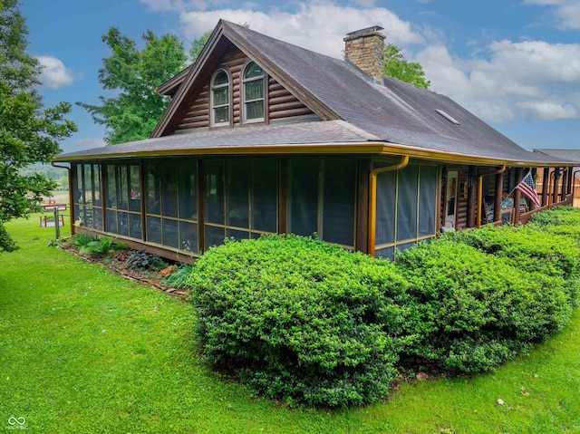 10484 N County Road 750 W, Freetown, IN 47235 - view of side of home featuring a sunroom, a chimney, a yard, and a shingled roof