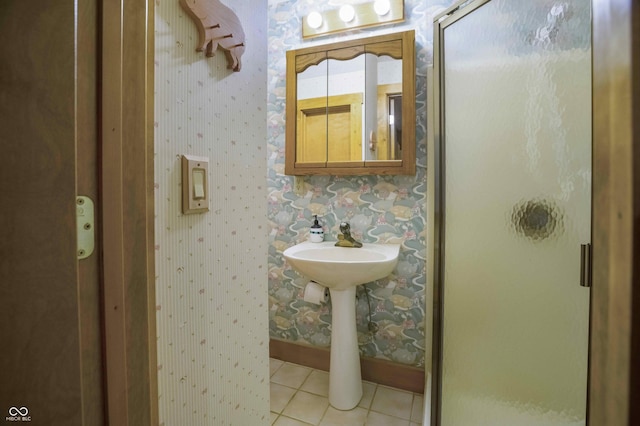 10484 N County Road 750 W, Freetown, IN 47235 - full bathroom featuring wallpapered walls, a stall shower, tile patterned flooring, and baseboards