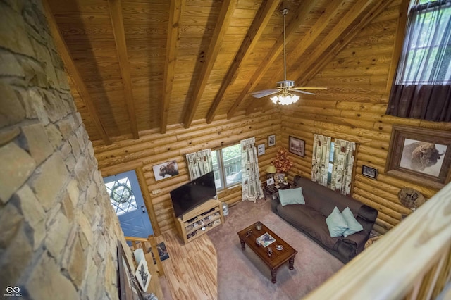 10484 N County Road 750 W, Freetown, IN 47235 - living room featuring wooden ceiling, rustic walls, and a ceiling fan